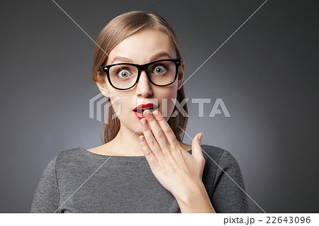 目を大きく見開いての写真素材