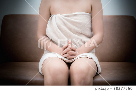 Women's panties on his finger at the man. On a white background