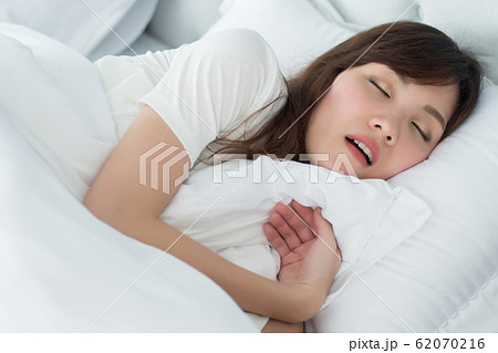 Woman in Black Underwear Sleeping in Bed in Seductive Pose without