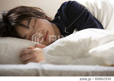 可愛い寝顔 学生の写真素材