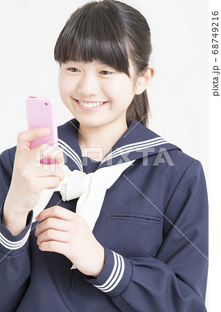 ガラケー 学生の写真素材