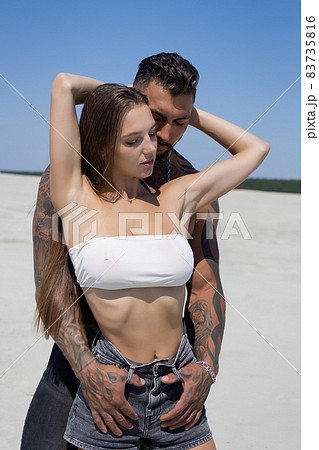 Naked women in panties hugging on beach - Stock Photo [84432709] - PIXTA