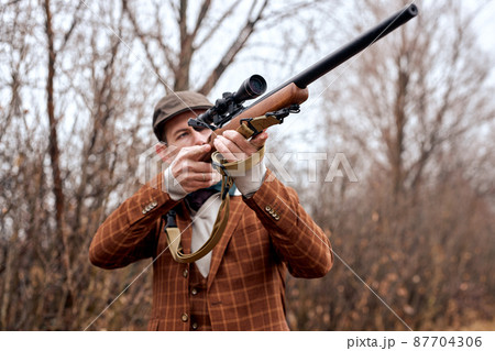 Confident caucasian hunter. American hunting rifles. Hunting