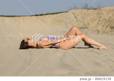 Naked women in panties hugging on beach - Stock Photo [84432709] - PIXTA