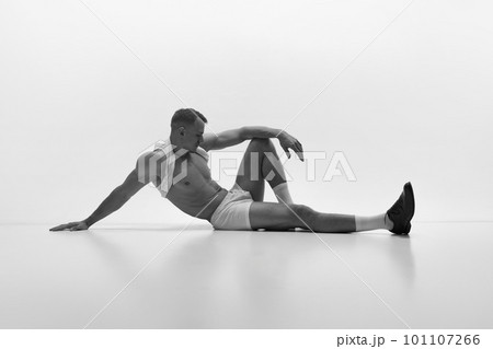 Black and White Portrait of Muscular Man with Wide Back Posing