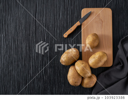 Photo of Potatoe isolated on wooden board isolated on white background  26739091 Stock Photo at Vecteezy