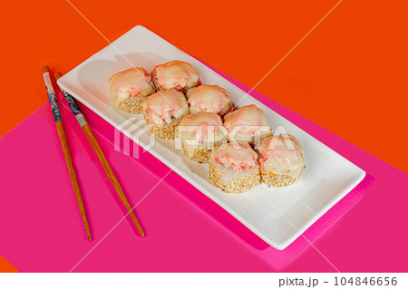 Sushi Set nigiri sashimi and sushi rolls on wooden serving board with soy  sauce and chopsticks over grey concrete background. Flat lay, space. Japan  menu Stock Photo