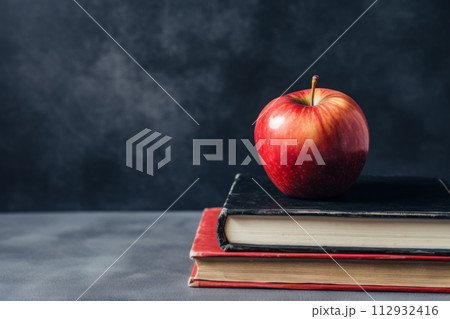 Shiny red apple on vintage books, concept ofの写真素材